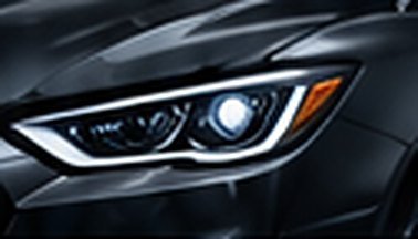 Car headlight close up